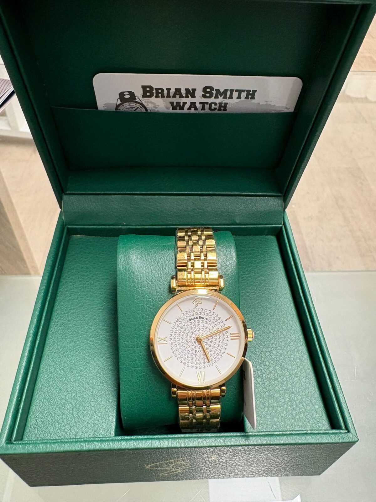 BRIAN SMITH DAMENUHR AUS GOLD MIT KRISTALL